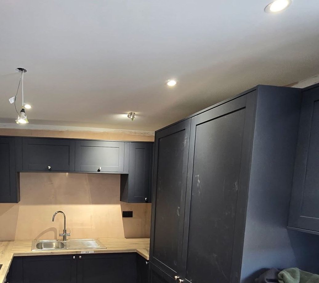 Navy shaker kitchen with wood worktops fitted in Greater Manchester